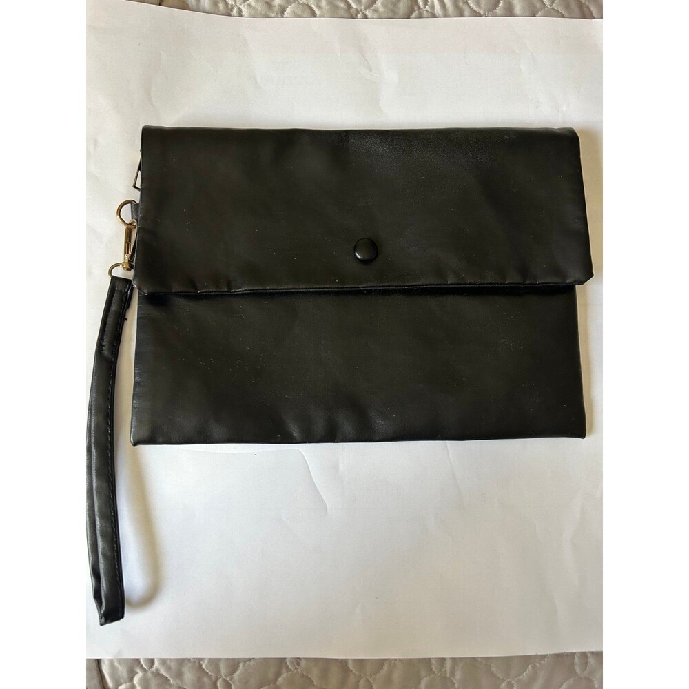 Black foldover clutch bag with a wristlet strap is a stylish and practical a